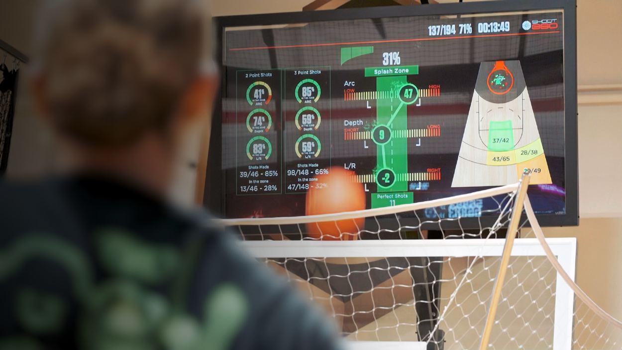 Basketball player viewing detailed shooting analytics and performance metrics on a Shoot 360 training screen.